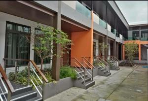 a building with stairs in front of a building at หอพัก ทูเอ็มเพลส 2M Place Apartment in Ban Khlong Nung