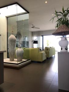 Posezení v ubytování Penthouse 3 chambres Vue Lagon imprenable
