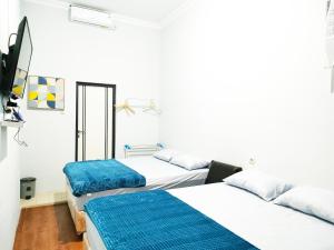 Postel nebo postele na pokoji v ubytování Ministry Homestay