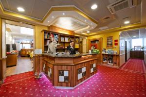 a large room with a counter in a pharmacy at Hotel Marco Polo Rome in Rome