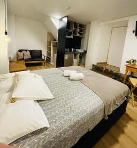 Un ou plusieurs lits dans un hébergement de l'établissement Blacky Hostel and Apartments
