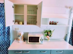 a toy kitchen with a microwave on a counter at 350m to beach pool villa in Hua Hin