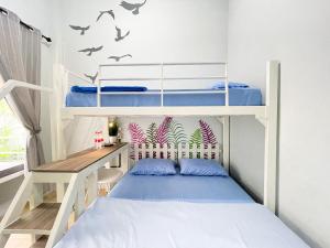 Postel nebo postele na pokoji v ubytování Ministry Homestay