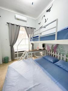 Postel nebo postele na pokoji v ubytování Ministry Homestay