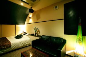 Postel nebo postele na pokoji v ubytování HOTEL CHECK INN BALI adult only