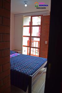 Giường trong phòng chung tại CASA ARMONIA SALENTO