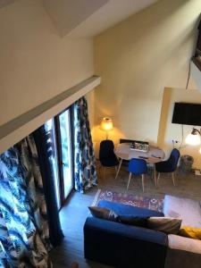 a living room with a couch and a table at Crystalville Apartment 542 in Bakuriani