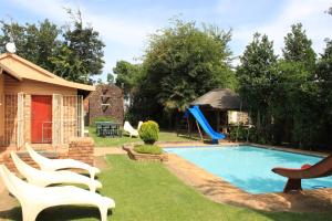 The swimming pool at or close to All Are Welcome Guest House