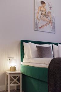 Postel nebo postele na pokoji v ubytování Apartamenty Plac Kolegiacki