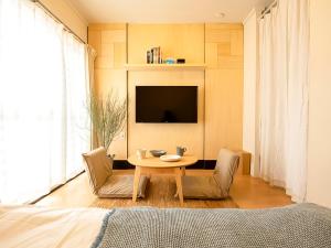 TV a/nebo společenská místnost v ubytování Guesthouse Life Field