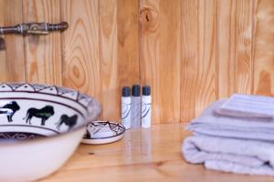 a bathroom counter with a bowl on top of a sink at Semowi Lodge in Mirapene