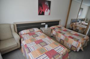 Posteľ alebo postele v izbe v ubytovaní Apartamentos Turisticos Vilagarcía- Rio Ulla