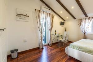 Posteľ alebo postele v izbe v ubytovaní ToMaDi Residence