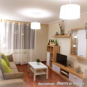 A television and/or entertainment centre at AMORES DE ASTURIAS