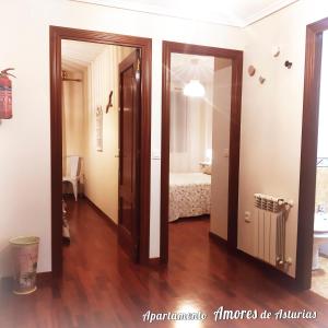 A bed or beds in a room at AMORES DE ASTURIAS
