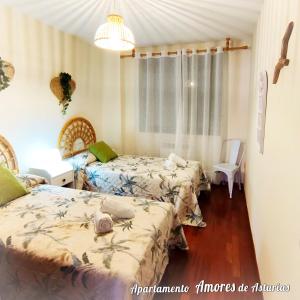 A bed or beds in a room at AMORES DE ASTURIAS