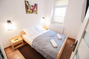 Posteľ alebo postele v izbe v ubytovaní Apartament City Center Standard 6