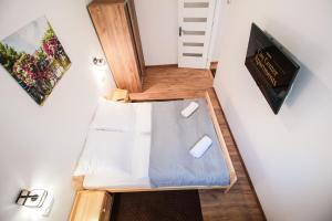 Televízia a/alebo spoločenská miestnosť v ubytovaní Apartament City Center Standard 6
