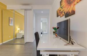 a white dining room table with a television on it at AV Domus Vatican St.Peter B&B in Rome