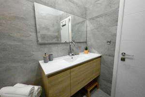 a bathroom with a sink and a mirror at Luxury Queen Mountian in Eilat +8 photos