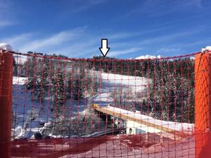 a net in front of a building in the snow at Haus ter Stege in Annaberg im Lammertal +4 photos
