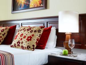 Säng eller sängar i ett rum på Albatros Spa & Resort Hotel