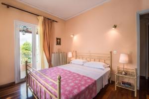 Posteľ alebo postele v izbe v ubytovaní Chara's House