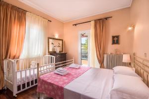 Posteľ alebo postele v izbe v ubytovaní Chara's House