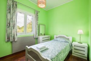 Posteľ alebo postele v izbe v ubytovaní Chara's House