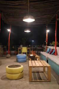 a person sitting in a tub in a room with lights at Moustache Khajuraho in Khajurāho