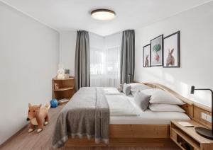 Postel nebo postele na pokoji v ubytování Lisi Family Hotel