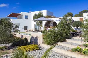 a view of a house with a garden at Villa Nubita in Sant Josep de sa Talaia