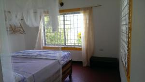 Postel nebo postele na pokoji v ubytování Germaican Hostel