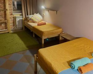 เตียงในห้องที่ Nice Hostel on Peterburgskaya