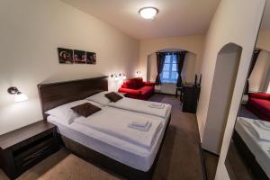 Voodi või voodid majutusasutuse Hotel Koruna Prachatice toas
