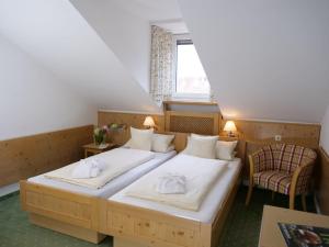 Ένα ή περισσότερα κρεβάτια σε δωμάτιο στο Hotel Garni Christl