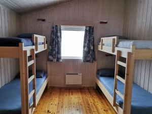Postel nebo postele na pokoji v ubytování Tron Ungdomssenter
