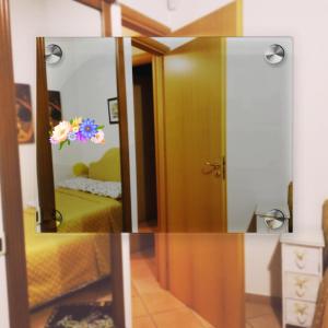 a mirror in a room with a bed and a bedroom at Amalfitani Salerno Centro in Salerno +69 photos