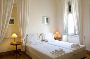 Katil atau katil-katil dalam bilik di Hotel Omiros