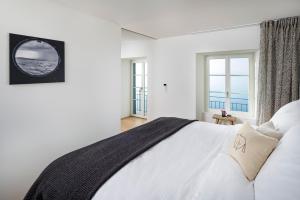 Postel nebo postele na pokoji v ubytování La Colombe Boutique Hotel