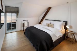 Postel nebo postele na pokoji v ubytování La Colombe Boutique Hotel