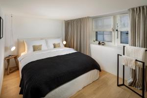 Postel nebo postele na pokoji v ubytování La Colombe Boutique Hotel