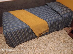 A bed or beds in a room at Atlantide Hotel