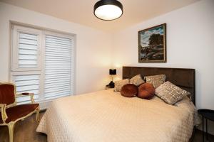 a bedroom with a bed with two balls on it at Žiedų apartamentai in Klaipėda