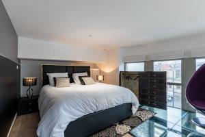 Voodi või voodid majutusasutuse GlamappartSpa Prestige New-York expérience toas