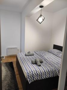 Ένα ή περισσότερα κρεβάτια σε δωμάτιο στο Apartman Golden Hill