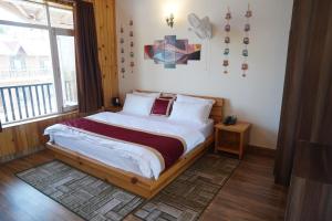 Postel nebo postele na pokoji v ubytování HOTEL DEV CHHAYA