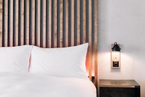 Cama o camas de una habitación en Alaïa Lodge