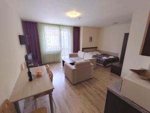 A bed or beds in a room at Nevada Aparthotel