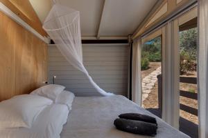 Postel nebo postele na pokoji v ubytování Be Vedetta - Relais & Glamping - Adult Only